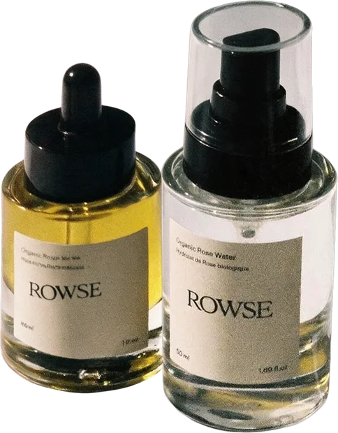 A serum dropper bottle and a rose water spray bottle