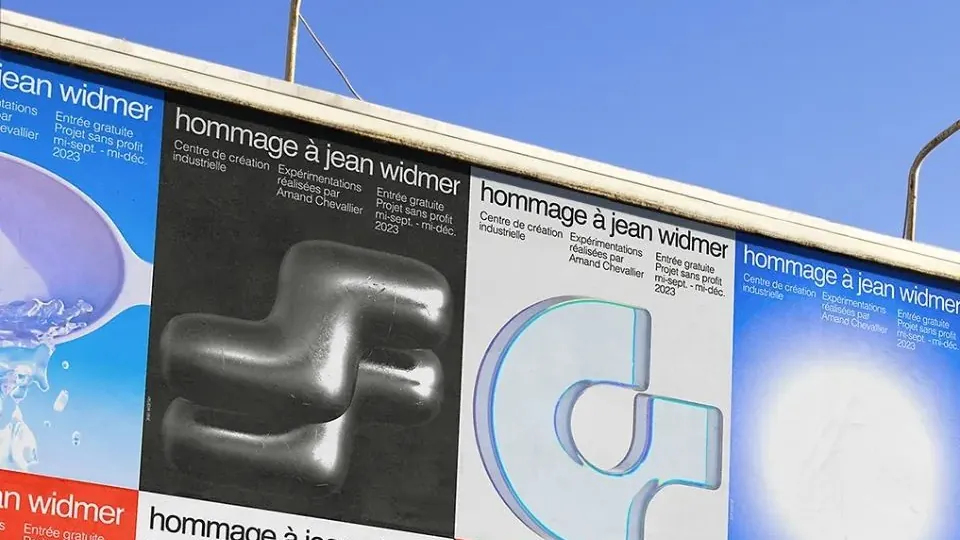 Four variants of one exhibition poster pasted side by side on a street hoarding under a bright sky